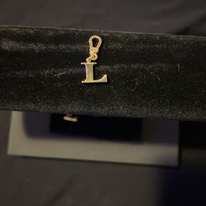 Coach “L” charm